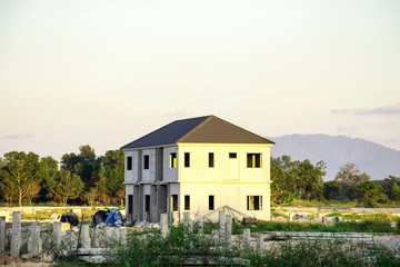 Unfinished building of house. Construction site of house with landscape mountain background, Background of building for business concept, Civil engineering work