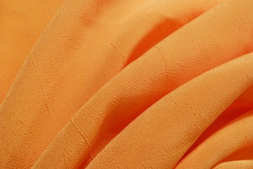 orange fabric texture of natural canvas background bright color