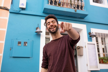 young man pointing at you