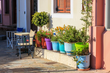 Fototapeta na wymiar Colorful flowerpots on the street of Nafplio town, Peloponnese, Greece