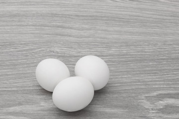 Eggs on a gray wooden table.