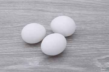 Eggs on a gray wooden table.
