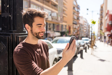 young man typing a message