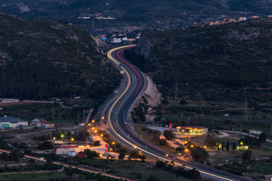 View of the Mediterranean highway AP7 at Denia in the province of Alicante after sunset photographed with long exposure