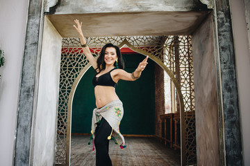 Belly dance costume. Costume for oriental dance. Eastern interior. Beautiful girl of eastern appearance. Dark long hair. Lessons Exercises. Movement in the dance. Bedleh or Beledi. Arab dance