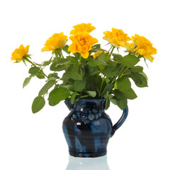 Vase yellow roses