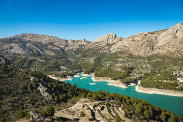 Fototapeta na wymiar Wild nature with blue waters mountains and river near the castle of Guadalest in Alicante, Spain