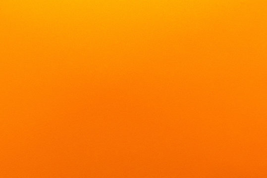 Orange gradient color with texture from real foam sponge paper for background, backdrop or design.