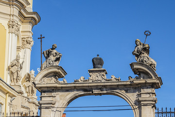 Double parade gate with baroque pediment and figures of saints to Lviv Greek Catholic Archbishop's Cathedral of Saint George (Ukr: Sobor sviatoho Yura, 1760). Lviv, Ukraine.