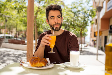 young man having a breakfast