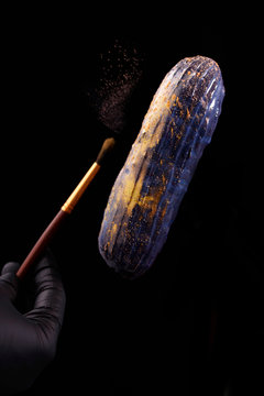 Beautiful bright eclair with blets on a dark background.