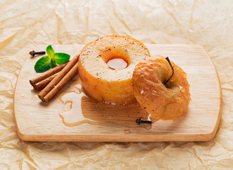 Apple baked with honey and cinnamon on burlap