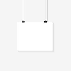 White poster hanging on binder. Horizontal template sheet