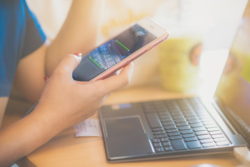 Businesswoman at workplace Woman working in home office. Closeup view of hand women touching mobile phone