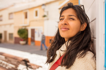 Young indian woman looking up