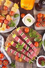 raw meat and fish skewer with sauce