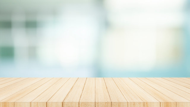 Wood table top on  with blur glass window wall background. For montage product display or design key visual layout background