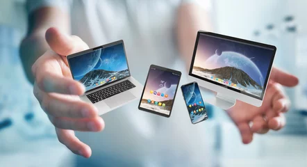 Foto op Plexiglas Businessman connecting modern smartphone tablet laptop and computer 3D rendering © sdecoret