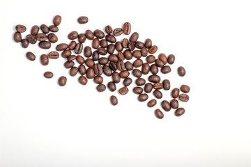 Roasted coffee beans, dark Roast coffee background. Closeup top view pile of coffee beans on white background, space for text