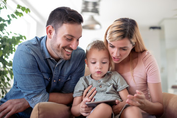 Modern family using digital tablet