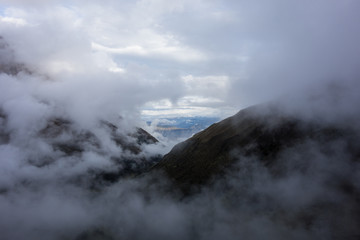 Mystical clouds opening a small window at the Salkantay Trek to Machu Pichu, Peru
