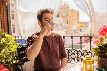 young man drinking a coffee