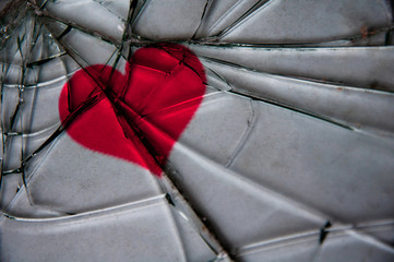 The image of the heart under the broken glass.