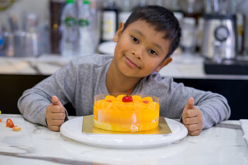 happy kid boy making a cake