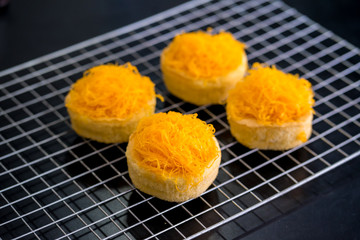Gold Egg Yolk Thread Cakes on grill, Thai sweet food