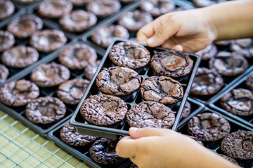 hands of the woman  making brownies