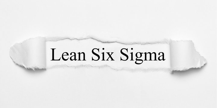 Lean Six Sigma on white torn paper