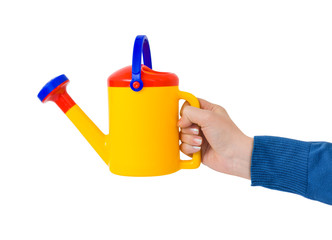 Hand with watering can
