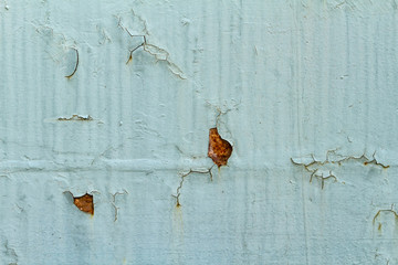 Old cracked Rusty paint metal background texture close-up