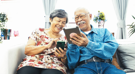Senior couple online shopping with smile face.