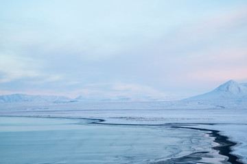 Naklejka na ściany i meble Winter in Iceland, a sea cove in the north.