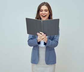 Young woman teacher wearing suit holding open book.