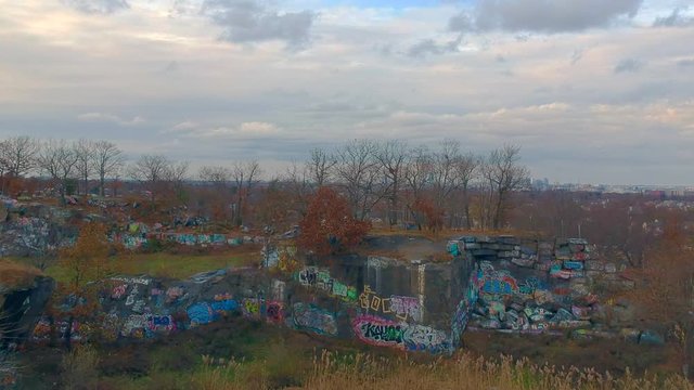 Drone flies over quarries overlooking Boston.
