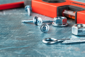 different construction tools on blue background