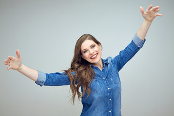 happy positive woman gives embrace with arms wide apart.