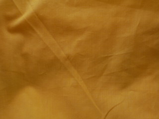 golden silk background,yellow cotton fabric texture