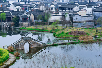 Fototapeta na wymiar Old bridge over the lake, Anhui,China