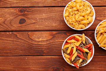 dried pasta on wooden background