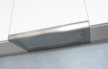 Cooker Hood. Modern air exhauster kitchen fan or range hood. Stainless steel chimney hood. Island...