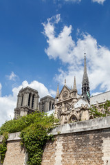 Fototapeta na wymiar Notre Dame de Paris Cathedral before fire. Southern facade with rose window and a spire on a roof. Sunny summer day