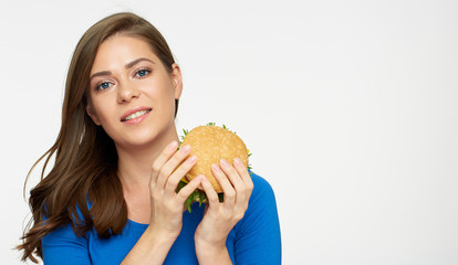 young woman holding classical cheeseburger.