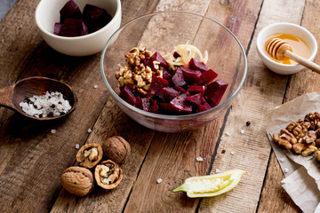 beetroot salad fish nauts and honey. Wooden table. Diet. Ingridients. Top view.