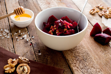 beetroot salad fish nauts and honey. Wooden table. Diet. Ingridients. Top view.