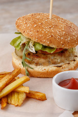 pork burger with french fries and ketchup selective focus