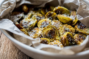 Baked cabbage with parmesan. Organic. Wooden table. Macro. Top view. Homemade. Dinner