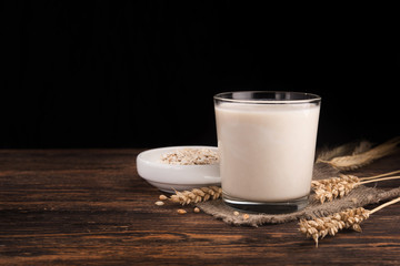A glass of oat milk and cereal oatmeal